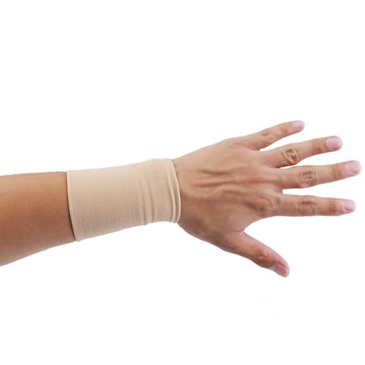 A wrist wearing a beige slip-on wrist compression sleeve, designed for support and pain relief.