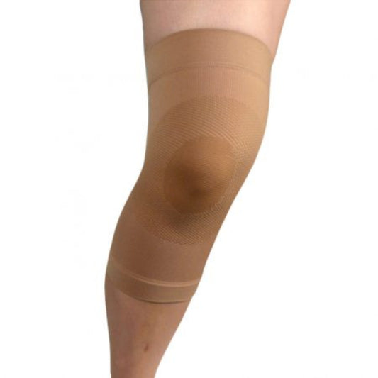 Beige knee brace on a person's knee against a white background