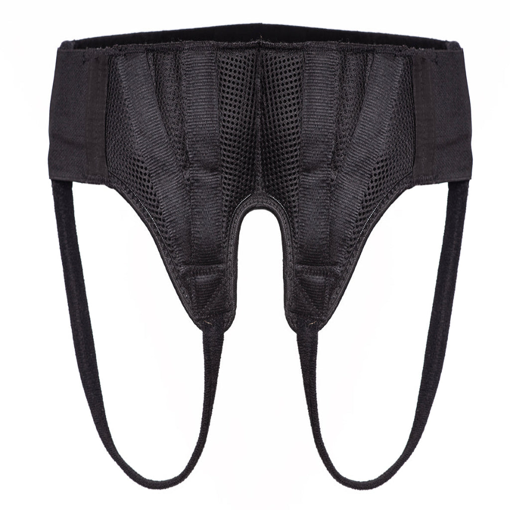 A black surgical hernia truss designed to provide support for a groin hernia.