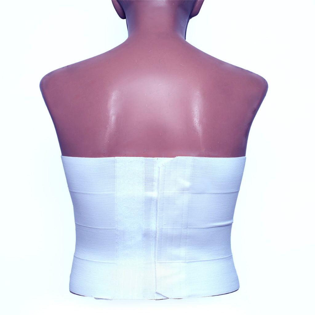 White strapless top on a mannequin with a plain background