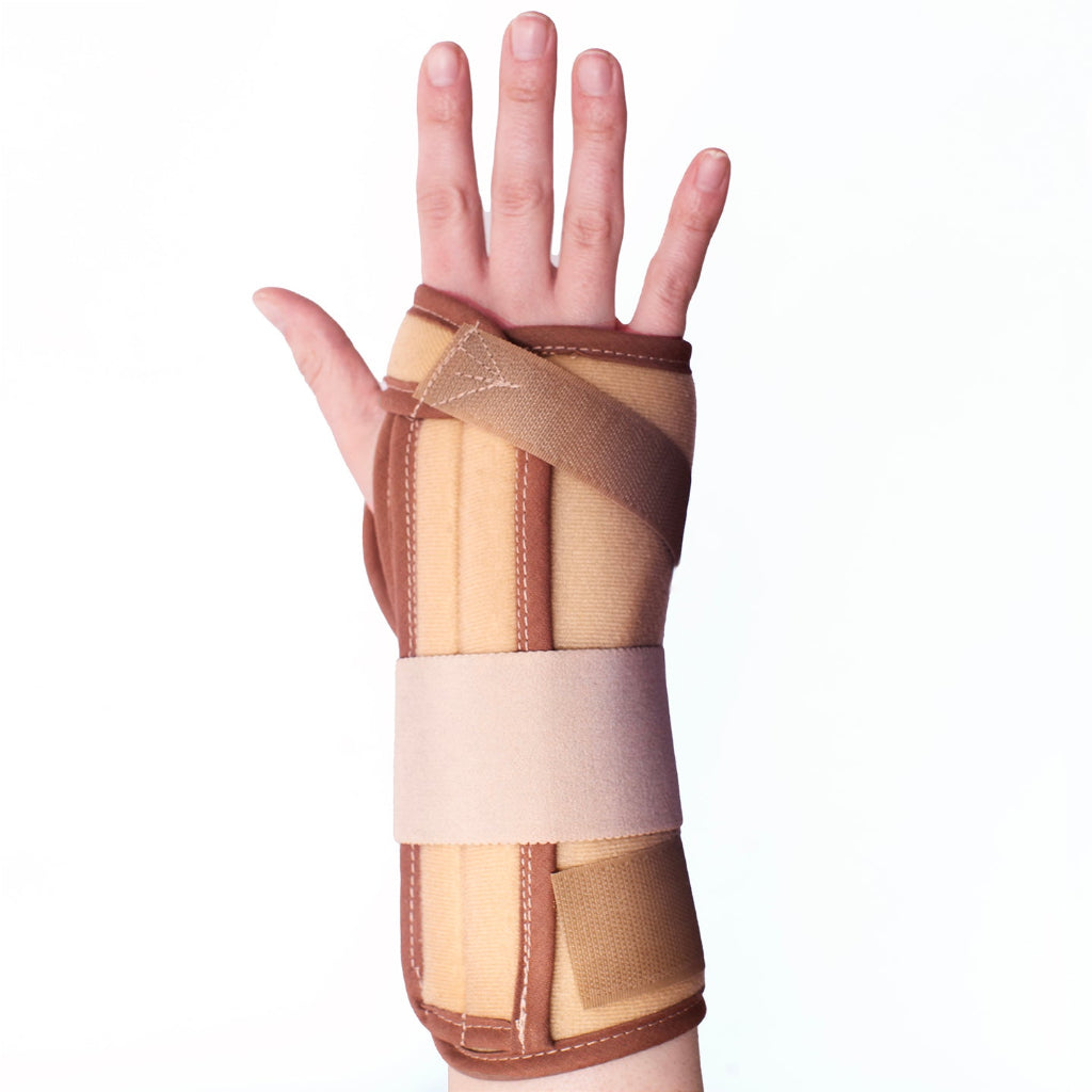 A wrist wearing a beige and brown contoured splint brace with adjustable straps and a padded metal spoon on the bottom side.